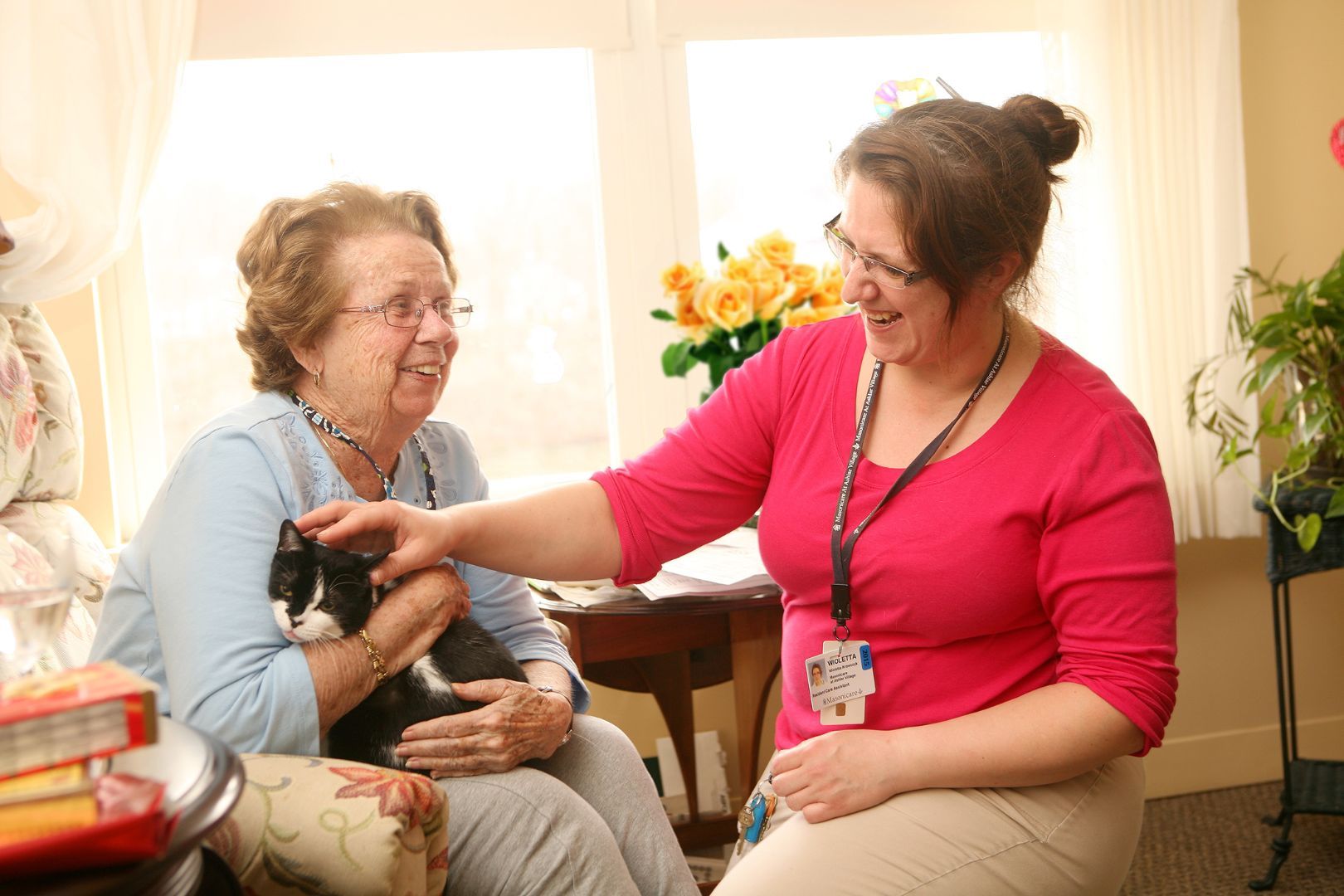 Resident_with_cat_summer_flowers_copy.jpg