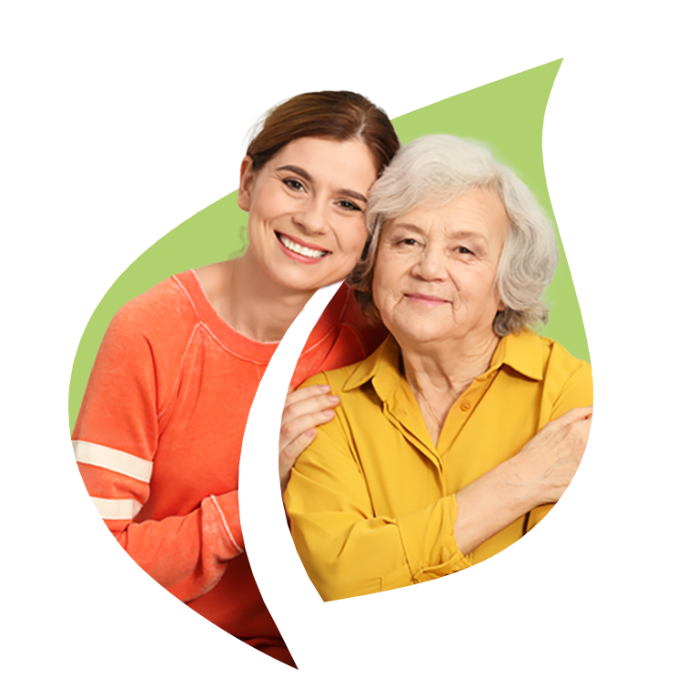 A female hospice care working with senior woman in an embrace over the Masonicare green leaf